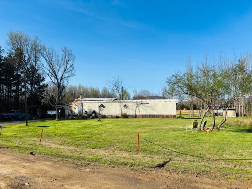 Unique investment opportunity on ~2.5 acres in Dardanelle! Property features two single-wide homes, a pond, chicken coops, and multiple outbuildings—great potential for a small homestead. Ducks and chickens can even stay! The main home offers 3 bedrooms and 1 bath in the original section plus an addition with a spacious bedroom with tall ceilings, a bathroom with jet tub, and laundry/mud room. Cozy wood-burning fireplace and mini-split HVAC. Second home is a 2 bed, 1 bath rental bringing $400/month and needs some TLC. Perfect for investors, rental income, or multi-generational living. No known restrictions. Sellers believe homes are affixed but buyer should verify. Many items may convey with acceptable offer.