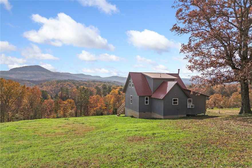 You will pull up to this property and your jaw will drop - the views are absolutely incredible!  If you are looking for a 3 bedroom 2 bath cabin in the Ozark Mountains, this is the one!  The cabin, built in 2007, is mostly finished on the interior and is primed and ready for your finishing touches.  The bathrooms and kitchen are in working order.  With a covered back deck, 4.7 m/l acres, close proximity to Hasty, Carver and Blue Hole inputs on the Buffalo River, this cabin and location are sure to please you!  Big Creek is a 5 minute, back road ATV drive.  This creek has water year round and is such a beautiful setting with huge sweeping bluff lines (like what you see on the Buffalo River at Steel Creek)! Make this your vacation home, your next investment property or your residence!  If you've been dreaming of a cabin with big views this one will check all the boxes for you!