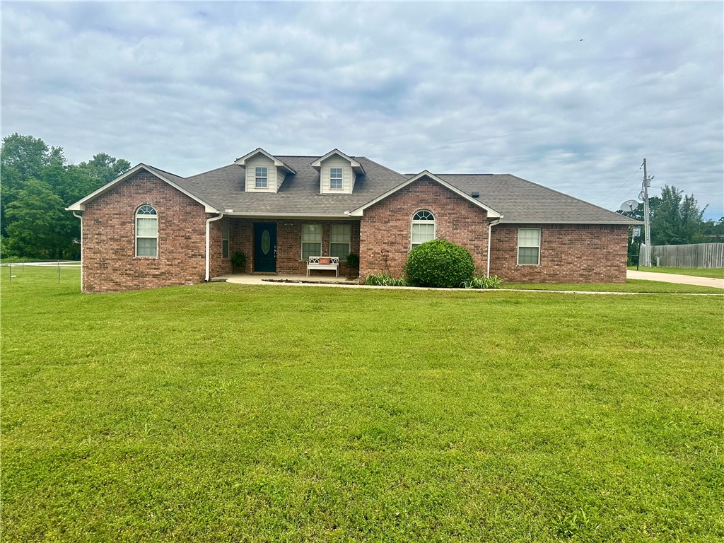 Come check out this spacious all brick home not far from Hwy 59. Boasts a large corner lot of .64ac mol that would be a great space for the entertaining the whole family, or even a small homestead. Master bedroom has a large on-suite with a whirlpool tub and separate shower, as well as a full walk-in closet with built-ins. Formal dining space is great for the holidays! Kitchen has an eat-in space as well as a peninsula for additional seating, and extra room for baking. This home has 2 bonus rooms. One would make a great craft or office space. The other bonus room is an enclosed breezeway that would make an awesome mud room or space for extra storage. The other bedrooms have closets with bars and shelves, and are a good size. Living room has an electric fireplace for cozy evenings. Harwood floors in main areas and ceramic tile through out the rest of the home. Covered back patio will be great for those summers BBQs in your fenced in yard. Set up a showing today!