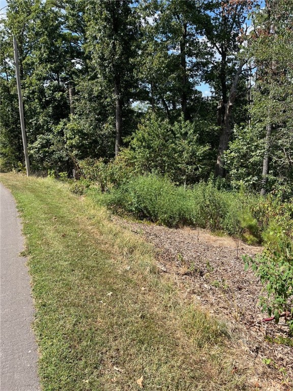 Centrally located this Bella Vista lot is located between BV Country Club and Scotsdale course -- recently renovated its links 18. Easy access to Hwy 279 for anyone to commute. Mountain Bike Capital these trails are so close Technical Difficulty & Tunnel Vision ready to test your skills. CC Dining, Pools & Parks.
