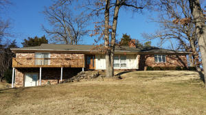 Here is a wonderful home that's ready for you! Home features 3 bedrooms 2 baths, large floor plan. Covered patio, deck, and 2 car garage. Home also features a walkout basement with lots of storage. A wonderful home in a great neighborhood, just across the street from the golf course community.