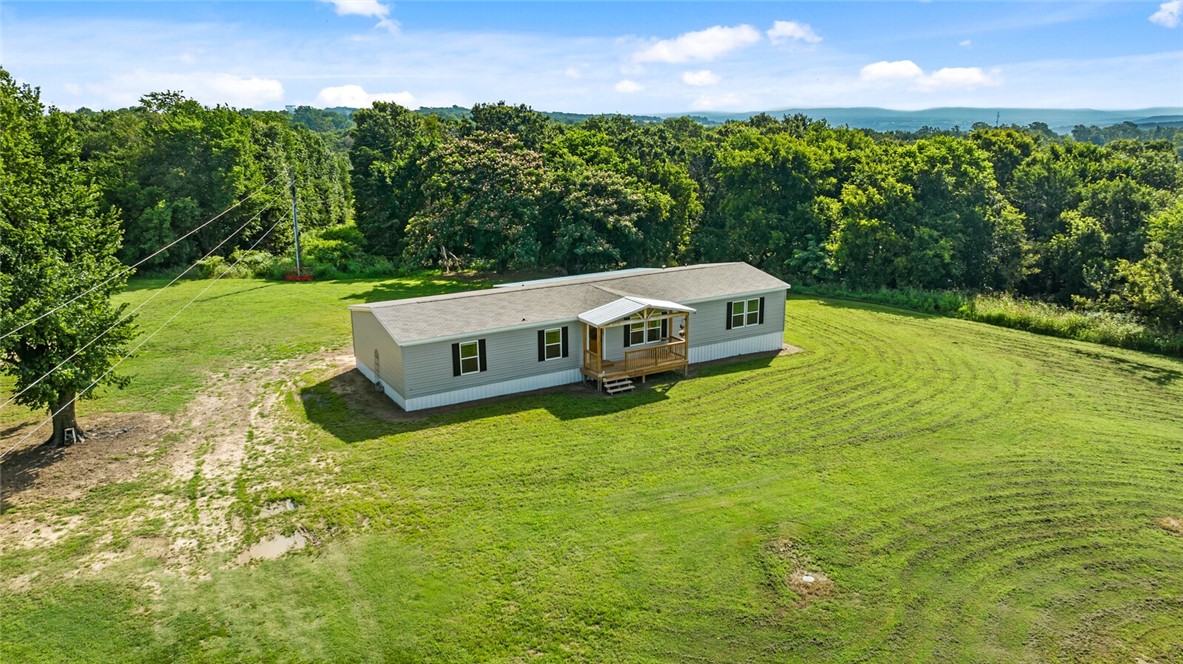 Lovely home on 4.5 ac mol (subject to a new survey), 5 bedrooms and 3 bathrooms, this 2024 Champion Home, Mallory Model with 2027 SF offers a wonderful option outside of city limits with public water, septic, all electric, deck to enjoy the surroundings, close to NWA and NEO both, less than 15 miles to Lincoln and a short 20 min to Siloam, 30 min to Fayetteville/Farmington. This a manufactured home on a permanent foundation, ready for a new owner! Come today!
