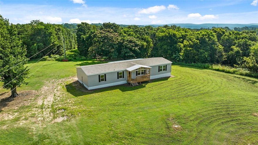 Lovely home on 4.5 ac mol (subject to a new survey), 5 bedrooms and 3 bathrooms, this 2024 Champion Home, Mallory Model with 2027 SF offers a wonderful option outside of city limits with public water, septic, all electric, deck to enjoy the surroundings, close to NWA and NEO both, less than 15 miles to Lincoln and a short 20 min to Siloam, 30 min to Fayetteville/Farmington. This a manufactured home on a permanent foundation, ready for a new owner! Come today!