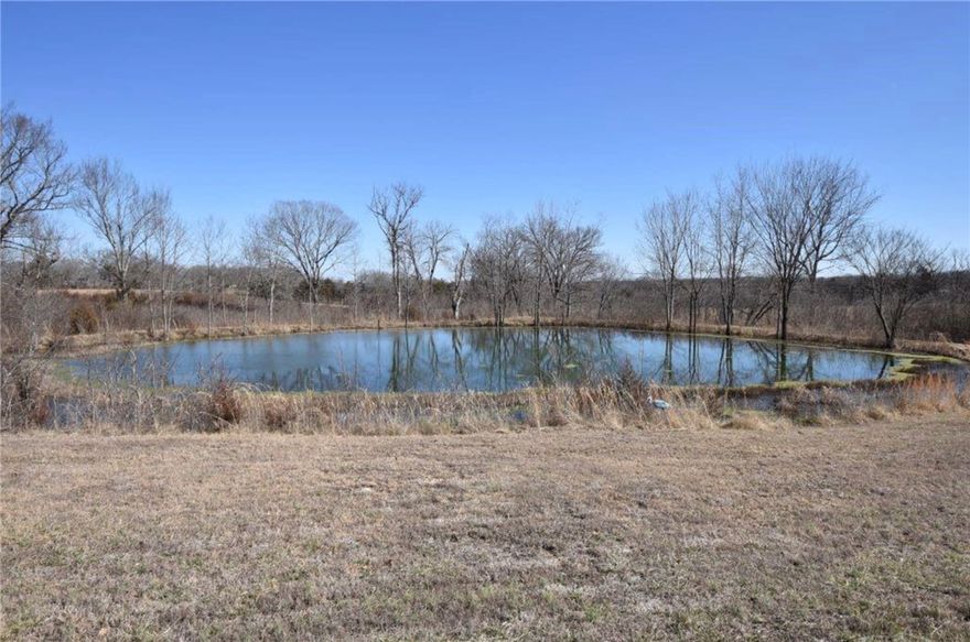 Rare 39-acre COMPLETELY UNRESTRICTED estate near the Missouri line—a powerhouse of income and development potential with NO HOA or build restrictions! This sprawling property features 1,200+ ft of prime hwy frontage with an ARDOT-verified traffic count of 1,300 vehicles daily—a premier location for high-visibility billboards or homegrown commercial ventures. The land is a diverse mix of high-yield pasture for hay share-cropping, 7 acres of prime hunting ground, and a serene private pond. Two residences offer total flexibility: an inviting, zero-stair ranch home with a spacious bonus room and new 3BR/2BA mobile home—perfect for rentals or multi-gen living. A dedicated shop provides room for any hobby or trade. Just minutes from Eureka Springs, this is a developer’s dream with the freedom to parcel off to ones desire. Surrounded by mature trees, it blends privacy with profit. Whole-house generator and riding mower. Secure your piece of the Ozarks with zero limits!
Also see MLS 1339788