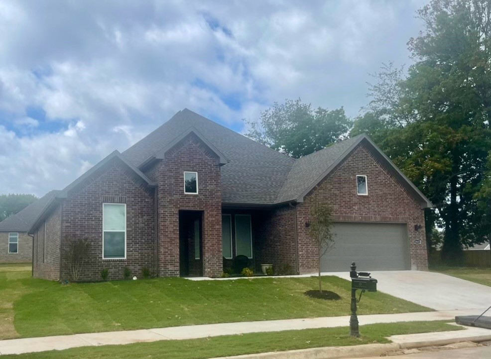 Riverwalk is one of Fayetteville's most unique subdivisions that was designed for perfection. It is located in East Fayetteville, just 10 minutes from the Fayetteville Square, filled with downtown entertainment and a variety of restaurants. This subdivision includes a community pool, walking trails, and river access. Welcome to Phase V Riverwalk, centrally located to all that Northwest Arkansas has to offer. This brand-new home will have LVP throughout. Kitchen will have 42-inch cabinets, stainless steel appliances, and quartz countertops! Living room will have a beautiful gas log fireplace with painted brick surrounds and white mantle. Cased windows in the living, dining, and bedroom one. The bedroom one will have dual sinks and quartz countertops, oversized walk-in shower. High-efficiency air conditioning system with programmable Wi-Fi thermostat. Exterior of homes will be brick or Brick/ LP Smart Siding per plan. Taxes and Parcel TBD.