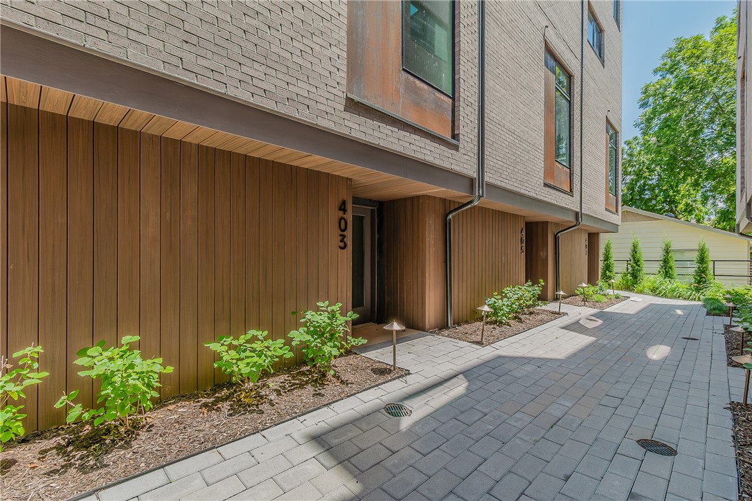 Welcome to downtown Bentonville! This pristine new construction townhouse is within walking distance to all your local favorites including The Momentary, Bentonville square, new Walmart campus, and trails. Featuring one bedroom, one bathroom, and a bonus loft area with a thoughtfully designed open floor plan. High-end finishes include custom walnut cabinets and quartz countertops throughout, built in Sonos speakers, a covered patio, and large windows providing an abundance of natural light. Bonus loft area is perfect for an office or additional bedroom.