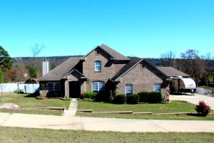 Large and lovely home in one of Russellville's most sought after neighborhoods! This 2560 sq ft home has room for one and all with 4 bedrooms plus a large office or den, a spacious, separate living room with fireplace, private formal dining room and a breakfast area off the nice kitchen plus a huge back yard and three car garage! A great opportunity to make Cove Landing your home and get all the room you need!
