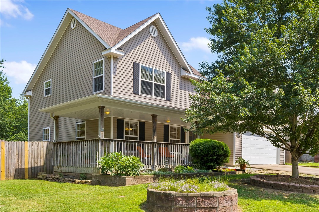 This wonderful home sits on just under 1/2 acres that is fully fenced with a double gate on one side for you to store your boat or add a small shop. You can sit on the back deck and have your morning coffee or go sit under the large trees that line the side of the yard and feel like you are away from everything. There are raised garden beds already in place and a storage building for the extras. The main level has a large eat-in kitchen with two separate pantries. The laundry room is also very large with a guest bathroom just off the kitchen. The living room has plenty of space for large gatherings or even an office area. Upstairs you will find the Primary suite with garden tub and separate walk in shower and two guest bedrooms that share a bathroom. The roof was replaced in 2022 and the range, dishwasher, water heater and HVAC were all replaced in 2021. Several windows have been replaced as well. This is a great home that is very close to the lake. Don't let this home get away before you can make it yours.