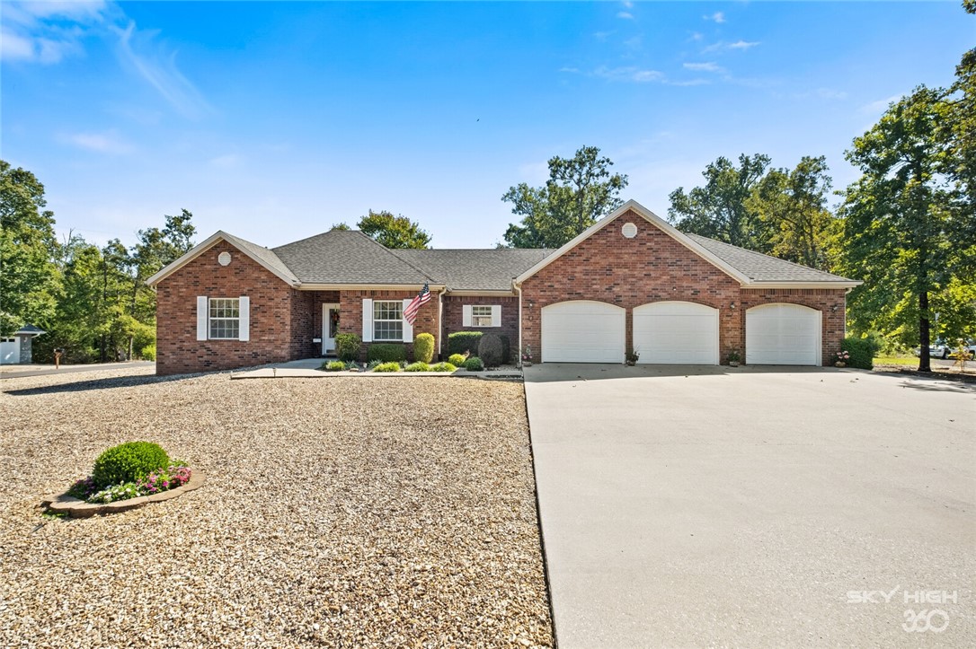Beautiful, well maintained all brick 3 bedroom, 2 bath home with 3 car garage on two level lots. 3rd car garage is a separate room that is heated/cooled so it's a great place to tinker all year round. There is an abundance of natural light in this home. New quartz countertops in the kitchen as well as new appliances (sink, garbage disposal, range, dishwasher, refrigerator, and microwave in March 2020, new roof and leaf shield on the gutters in November 2020. The 12 x 16 storage shed has electricity. Refrigerator, washer and dryer convey. Rose bush by shed does not convey.