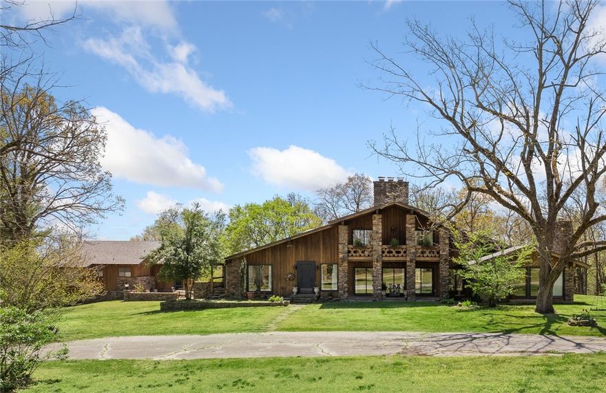 If you’ve ever wanted it all in a home-this is it!! This stunning estate offers 7 spacious bdrms, 7 baths, and a 3-car garage w/guest house on 9.4 acres of paradise!! The heart of the home features a dream kitchen complete with Sub-Zero refrigerator, all appliances, numerous cabinets & a butler’s pantry perfect for entertaining. Enjoy cozy evenings by one of the 4 fireplaces, or indulge in relaxation in your own private sauna. The light-filled interiors create an inviting atmosphere throughout, and the basement comes fully equipped with everything you need for the ultimate movie night. Step outside to your own mini-farm with a barn already on site. Whether you’re looking to grow, raise, or play, there's room for it all, including a private tennis or pickleball court. Multiple expansive decks offer perfect spots for entertaining or simply soaking in the serene views. The exterior has been freshly power washed/stained, & a new roof installed in 2024 means peace of mind for years to come.