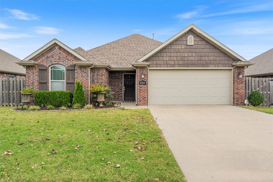 Beautifully maintained 3-bedroom, 2 bath home in West Fayetteville's Villages of Sloanbrooke. Features an open layout filled with natural light and a cozy fireplace. The kitchen offers, stainless steel appliances, granite countertops, and plenty of counter space. Enjoy a large private backyard - an open canvas with a covered patio and privacy drapes, perfect for relaxing, or entertaining. Conveniently located near NWA trails, shopping, dining, and the University of Arkansas. This charming home is ideal as a starter, rental or a forever place to call your own!
