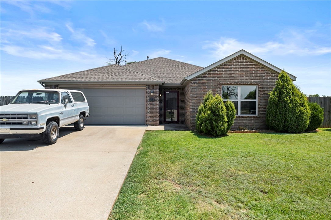 Welcome to this charming 3-bedroom, 2-bath home on a spacious .27-acre corner lot in Centerton! Built in 2013, this 1,431 sq ft home offers an inviting open floor plan with beautiful hardwood floors throughout the main living areas. Enjoy cozy evenings by the gas fireplace in the living room, highlighted by natural light and a warm, welcoming feel. The master suite features a stylish tray ceiling, a private bath, and a walk-in closet. The fully fenced backyard is perfect for relaxing or entertaining, offering both privacy and space. Located just 11 minutes from the Walmart Home Office and close to schools, parks, and shopping, this home blends comfort, convenience,Ā andĀ charm.