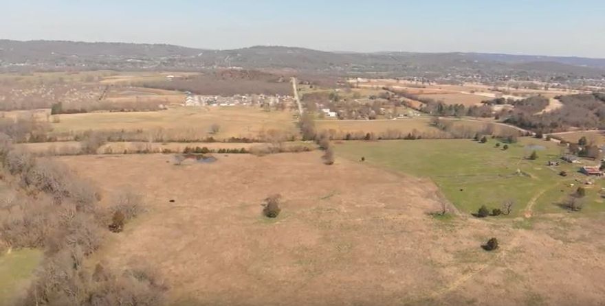 100+ acres less than 5 miles form downtown.  White River runs through property on the western edge.  Convenient to schools, golf course and shopping.  Wonderful view of University of Arkansas skyline including Old Main.