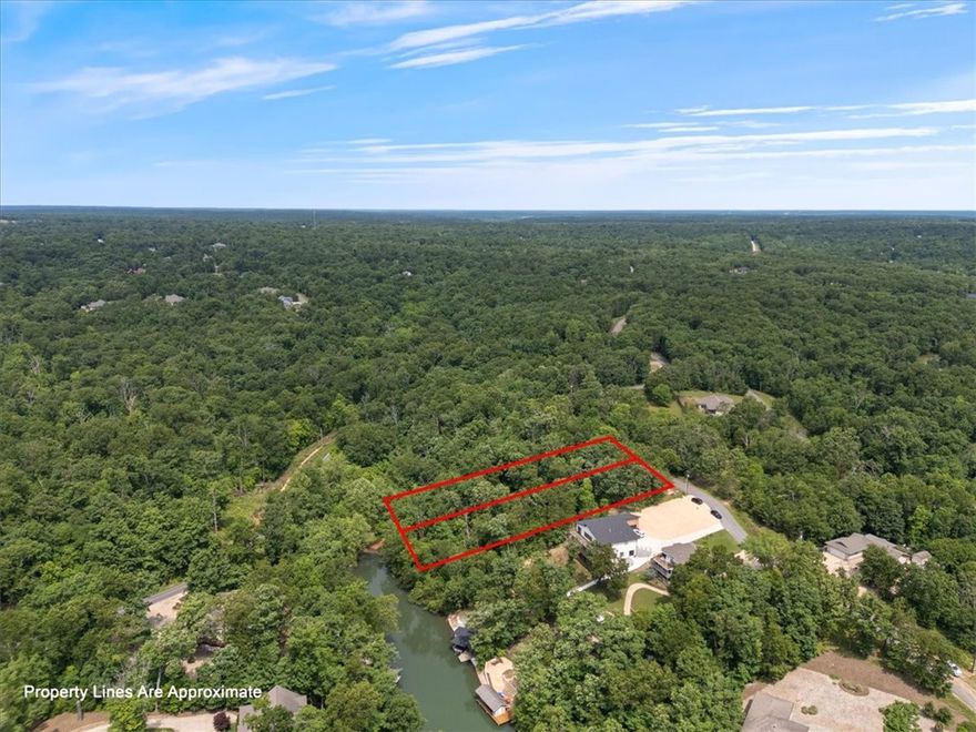 It's LAKE TIME!  Loch Lomond is the largest lake in Bella Vista.  Ready for your dream house and a spectacular custom dock.  This is a .63 acre lot, and you have the option to buy the adjoining lot MLS # 1309390 for a 1.25 acre combined estate  The future of Bella Vista looks bright, with our current fabulous bike trails, lakes, golf, tennis, fitness and more developments to come!
