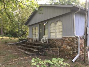 Rustic Ranch Property! HUNT! FISH! Or just watch the plentiful deer off your private deck! . Picturesque Setting! 3 bedroom 2 bath home features Spacious bathrooms and plenty of room to stretch out! Minutes from Piney Bay..(Additonal 5 acres available.) Priced for quick sale! Call today for your private showing.