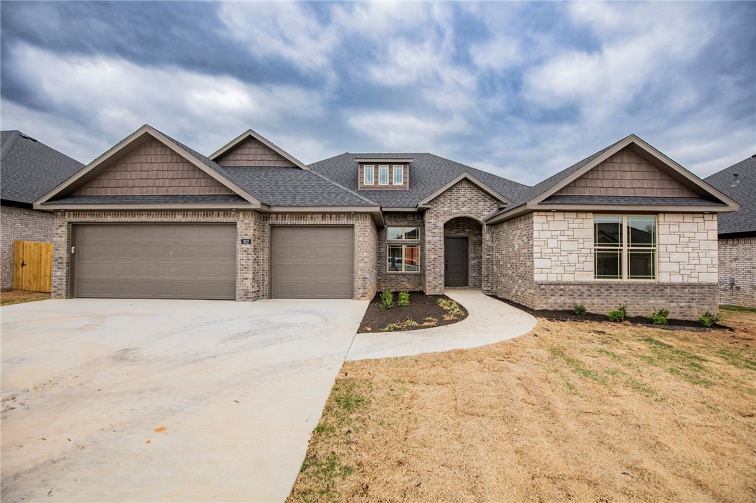 This new construction home features 4 bedrooms, 3 bathrooms, and a 3 car garage. Located in Cave Springs, right in the center of NWA. Spacious open floor plan includes large living room which opens onto a covered outdoor entertainment area, complete with fireplace, perfect for those who love to entertain. This home is adjacent to The Creeks Golf Course, 12 minutes from XNA and 3 minutes from Hwy 612. Agent owned.