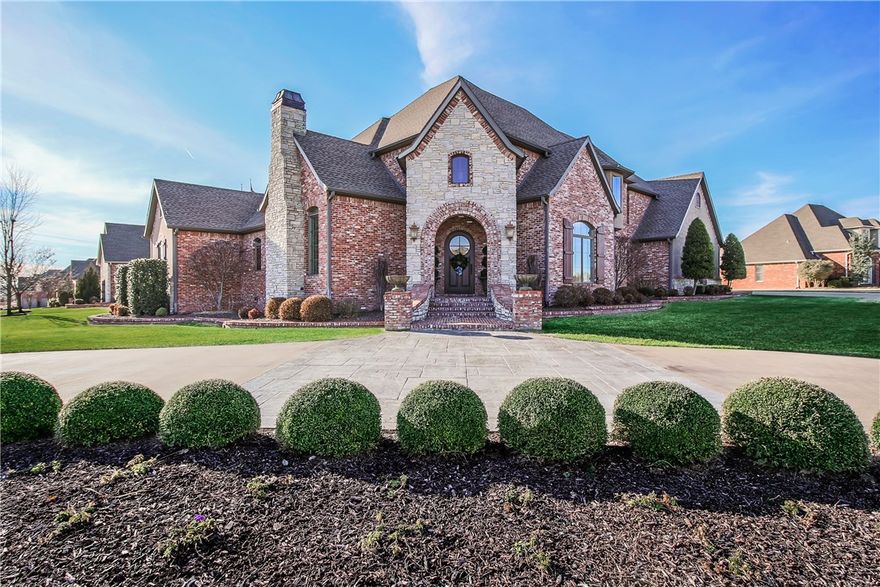 First time on the market!  This elegant custom-built Country French-style home in Pinnacle Country Club is situated on a 0.51 acre corner lot with front circle drive. Entertain formally in the stylish living room with limestone fireplace and vaulted ceiling with wood beams or in the intimate dining room with wet bar. The heart of the home boasts a two story family room, upscale kitchen with custom cabinets, center island, and top of the line stainless appliances. The main level home theater is a must see with stadium seating, Lutron scene lighting, & beverage center with ice maker. A private executive office features numerous built-ins. Recharge in the main level master with luxurious bath, his and her vanities, and walk in closet. The additional main floor bedroom has a full bathroom that doubles as a pool bath. Upstairs offers additional living space in the bonus room loft with half bathroom, storage closet, and veranda access. Two additional bedrooms with a jack-and-jill bathroom finish off the upstairs.