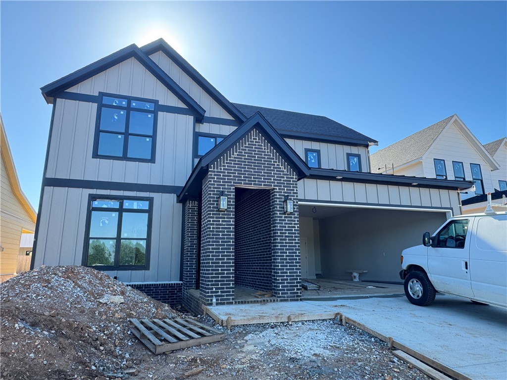 Welcome to Meadow Brook in SW Rogers! Great community in the best location! This plan features 3-4 bedrooms (2 flex spaces either bedroom 2 or study option as well as upstairs bedroom 4 or bonus room). All bedrooms have walk-in closets with plenty of storage! Downstairs you will find the primary bedroom. Great layout with open kitchen/living room area. Kitchen has large island to sit up to 6 bar stools, built-in gas cook top, built-in oven and microwave, large pantry, and eat in dining area. Primary bedroom feature en suite bathroom with soaking tub, walk-in shower, his and hers separate vanities, and large closet with lots of built-ins. Bedrooms 3 & 4/bonus room are upstairs along with a full bathroom. Enjoy the evenings grilling on the covered back patio! Can't beat location being only minutes to shopping, dining, groceries stores, and only steps to the Razorback Greenway Trail.
