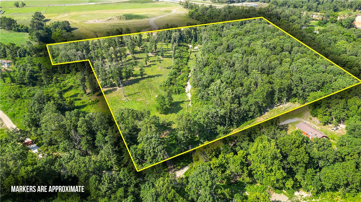 Discover the perfect blend of privacy and convenience with this approximately 10.18-acre property, tucked away on Holmes Road in Bentonville. This serene retreat features a beautiful mix of open land and mature trees, along with a charming wet-weather creek winding through the property. While youāll feel a world away from the hustle and bustle, this location is just minutes from XNA and the planned expansion of the XNA Access Road, which will soon connect directly to Highway 612 for even easier regional access. Whether youāre envisioning a private estate, hobby farm, or simply a place to enjoy nature, this property offers endless possibilities in one of the fastest-growing areas of Northwest Arkansas.