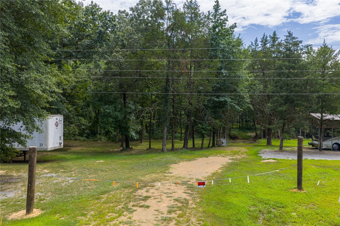 Welcome to your future homestead! This expansive 64.47+/- acre property offers a rare combination of privacy and accessibility. Nestled in a tranquil setting, you'll enjoy the peace and quiet of country living while being just minutes from the interstate. The land is ready for development with electric and water already onsite; a septic system is required. Whether you're dreaming of building your custom home, starting a farm, or investing in land, this property provides endless possibilities. Don't miss out on this unique opportunity.
