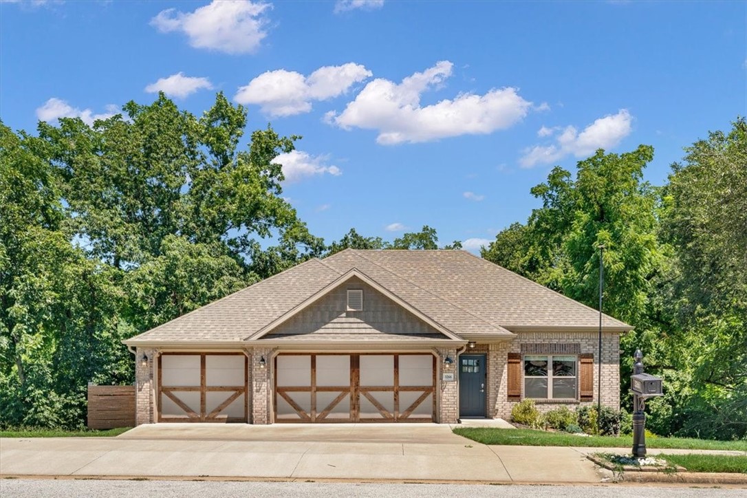 Experience comfortable living in this stunning Springdale home nestled on a beautifully landscaped 0.42-acre lot with a heated 3-car garage. Spacious, open main floor flows effortlessly for entertaining and everyday life, featuring large covered decks on both levels that invite you to relax while enjoying serene backyard views. The kitchen features granite countertops, sleek stainless steel appliances, and ample storage, making it both functional and stylish for everyday cooking. Retreat to the main-level primary suite boasting a double vanity, tile shower, custom built-ins, and a generous walk-in closet. Downstairs, find three additional bedrooms plus a flexible fourth bedroom with direct access to the lower deckāideal as a bonus or guest room. Plenty of storage is available with easy interior access to a large space beneath the house. Close to quality schools, Razorback Greenway, and JB Hunt Park, this home offers a great balance of comfort, space, and convenient community access.