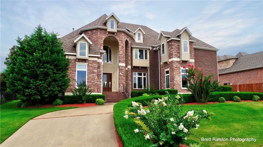 This home is wonderful inside and out!  Great home for entertaining! New roof in 2020. 2-10 Home Warranty will transfer to the buyer. The entrance welcomes you with a grand staircase, Formal Dining Room & Formal Living Room with soaring ceilings. Natural light shines through from grand windows with elegant window coverings. The Brazilian Cherry floors throughout the entire home add warmth. Large kitchen has gas 6 burner w/griddle range, 2 dishwashers, 2 pantries. Lovely glass display cupboards open up to family room. Upstairs boasts 2nd Master, which could be bonus/game room, and 3 other bedrooms with their own private bath, and Exercise room as well. The outside backyard has 2 areas for relaxing and entertaining. 20x15 Arbor area, and a covered kitchen with gas grill, and a wood burning fireplace. Priced below appraised value. This is a must see!