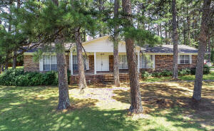 Beautiful tree covered lot enhances this one owner home. Located in an established neighborhood, this home features two living areas and formal dining. Den with wood burning fireplace and built-ins. Double ovens. Large laundry off of kitchen. 3 bedrooms and 2 baths. Covered patio.