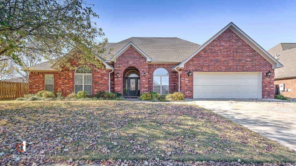 FABULOUS ONE LEVEL HOME IN COLLEGE PLACE SUBDIVISION WITH CLOSE ACCESS TO I-49! Beautiful all brick home with charming curb appeal on a quiet street with sprawling backyard featuring a spacious deck and lots of privacy! Inside you will find a split floor plan with lots of custom features and updates including beautiful crown molding, new paint and carpeting, updated master bath with quartz countertops, new dishwasher and cooktop, new roof, gutters and fence! Great floorplan with lots of windows bringing in natural light. Very spacious kitchen with beautiful cabinetry that opens to a hearth room and breakfast area! HUGE laundry room with sink! Easy access in and out of the subdivision! Hard to find one level 4 bedroom home!!