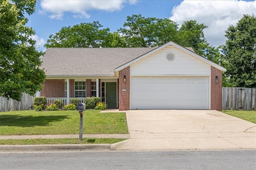 Huge .42 acre lot sets this 3 BR/2BA/2 car garage charmer apart in the neighborhood with a unique privacy.  This location is walking distance to Kessler Mountain Trails, Colbert Middle School, Owl Creek Elementary, Boys & Girls Club.  Also convenient to I-49, Walmart, Aldi and U of A.  MOVE-IN READY. Full brick exterior with wood privacy fence.  Enter living room with expansive vaulted ceilings and fireplace with marble surround and timber mantel.  Kitchen with quartz counters, stainless appliances and designer marble backsplash.  Breakfast room with bay window.  Open floor plan.  Updated lighting and plumbing fixtures.  Luxury vinyl plank throughout.  Split bedroom plan with walk-in closets.  Ceiling fans and 2” faux wood blinds. Separate laundry/mud room.  Refrigerator, washer and dryer negotiable.