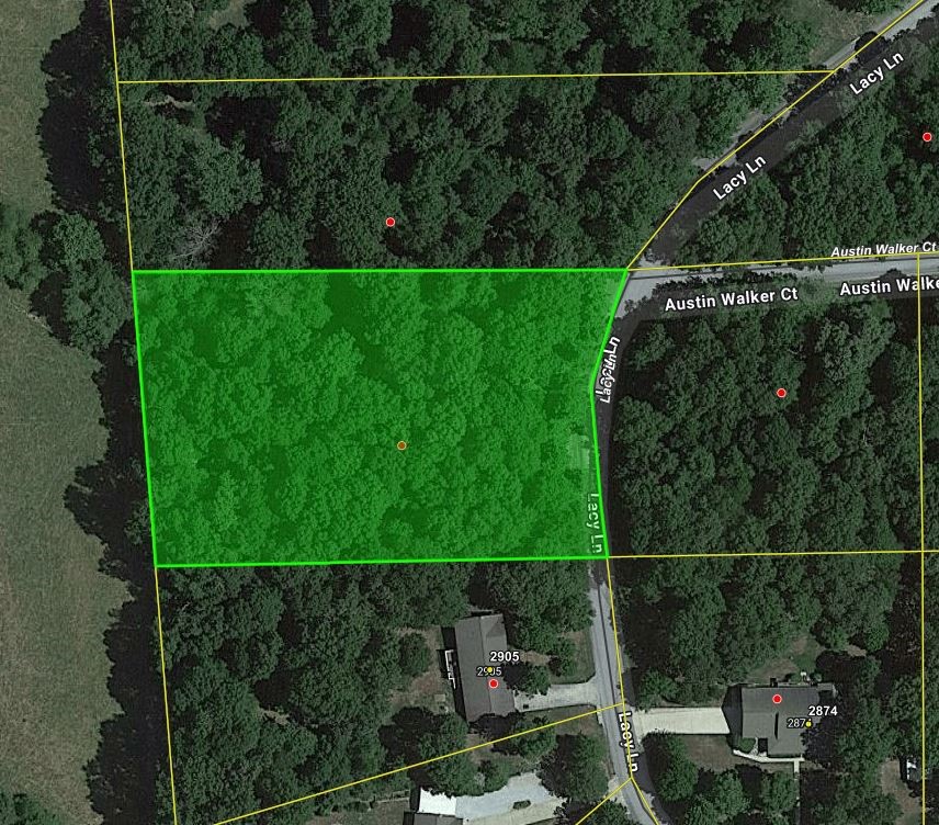 Wooded lot on paved road with water & electric available. Great building site in established neighborhood. No mobile home allowed.