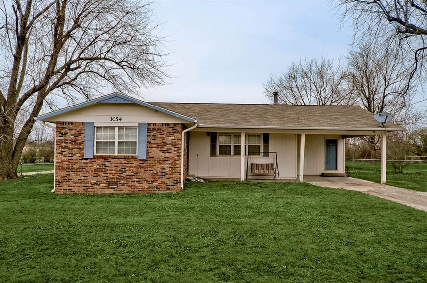 Perfect home for a first time home Buyer or an investment property! This charming home with an oversized lot and large back deck is conveniently located just off off Hwy 265 and Don Tyson and just minutes aways from Hwy 71. This home is very well maintained. Many updates and improvements throughout home including; roof was replaced in 2011, wood flooring in living room 2007, new central heat/air unit in 2008, and new water heater in 2009. Don't miss out on this home!