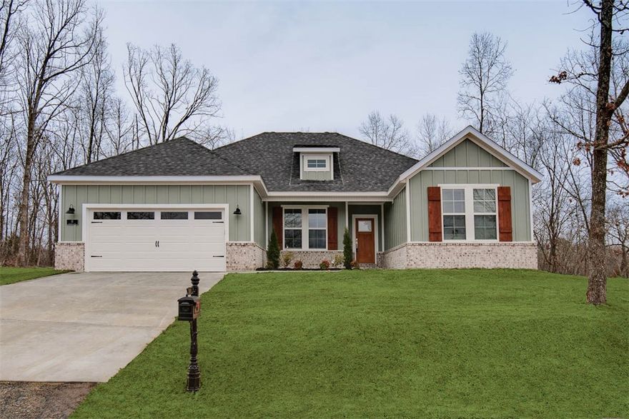Stunning new cons't home located just down the street from the Back 40 Trail! Perfectly situated just minutes away from Lake Ann and Metfield Golf Course. This property boasts a flat .32-ACRE lot with a huge side yard. Step inside to discover a beautifully designed interior w/a split floor plan & high-end modern finishes throughout. The spacious living area showcases vaulted ceilings w/elegant beams, creating an inviting atmosphere. The kitchen features sleek 3 cm quartz countertops, a gas range, custom cabinets, and stylish stainless steel appliances. Retreat to the luxurious primary bath, which boasts a huge walk-in closet, a large custom walk-in tile shower, and a soaking tub. 2 covered patios.  As an added bonus, receive $3,500 towards buyer's closing costs when working with the builder’s preferred local lender!  This home is eligible for RD financing (no down payment)!