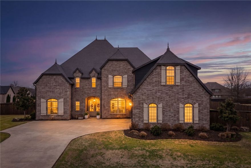 Remarkable custom builder's home where craftsmanship and designer details meet effortless luxury living. Every inch of this 5,000+ sq. ft. masterpiece is thoughtfully appointed, from the spacious eat-in kitchen with oversized pantry and custom Butler's Pantry, to the primary suite retreat with its abundant windows, and rolling-ladder closet built for real life. A dedicated Media Room and sprawling Bonus/Rec Room with wet bar anchor the home's entertainer credentials. Four bedrooms with a total four and a half baths give you an ensuite in every bedroom. The three-car garage and premium lot in one of Cave Springs' most sought-after large-lot communities round out a home that checks every box. Step outside to outdoor living that matches the interior's feel and look complete with auto shades across the patio.  There's also a tornado shelter built into the garage! This rare Ridgewood home brings both the WOW and the warmth of this special community! New outdoor kitchen, updated flooring, updated kitchen, and 1 new HVAC.