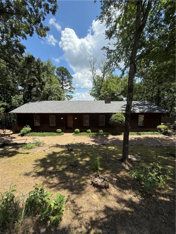 Perched on the bluff of Skyline Drive, this beautifully renovated home offers breathtaking panoramic views of Russellville. Recent updates include a modernized kitchen with new appliances, fully remodeled bathrooms, and refreshed finishes throughout. The home features two spacious living areas, a bright sunroom, an upper deck, and a lower closed-in porch—perfect for enjoying the stunning surroundings year-round. The main level includes a massive, updated master suite and two additional bedrooms, while the fully finished lower level provides a second living space ideal for guests or recreation. Whether you're cooking in the upgraded kitchen, relaxing in the sunroom, or waking up to bluff-top views, every space is designed to showcase the natural beauty that surrounds you.