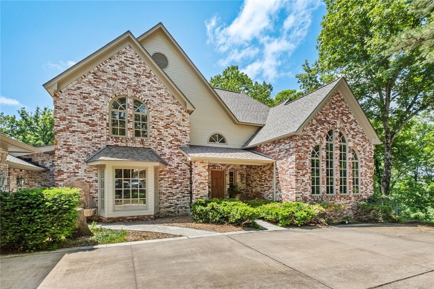 Private luxury estate on nearly 27 acres with custom home, coach house and pool! This retreat offers privacy, scenic views and high-end amenities. Main home features 4 beds, 3.5 baths, open living/dining, sunroom and game room with pool table, full bar and lounge. Master suite has its own sunroom and spa-style bath. A gourmet kitchen with dual islands and ample cabinetry is ideal for entertaining. Highlights include cathedral wood ceilings, natural paneling, sealed brick floors, hardwood, tile, carpet, double-pane windows, whole-home filtration, abundant insulation, passive solar design, mudroom with butler’s pantries, and attached 2-car garage. Outside, enjoy a large gunite pool with surrounding decks—perfect for relaxing or hosting. 2,560 SF coach house has a 2-car garage, glassed-in room with half bath below, and unfinished 2-bed apartment with kitchen and full bath above—ideal for guests, rental or multigenerational living. Wooded acreage, rolling hills and abundant wildlife complete this unique luxury oasis!