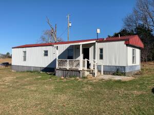 Awesome view with this extremely clean 2 bedroom, 2 bath mobile home on 2.92 acres. Just off Hwy 206 East. Newer pear, apple, apricot and cherry trees with climbing concord grapes. Small storage building with chicken coop. This cozy little jewel has immediate occupancy and won't last long so hurry to purchase. Only 11 miles to the beautiful Buffalo River for a daily swim or kayaking!