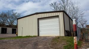 This price includes 1800 square foot shop building and additional vacant lot with access from Main St. Convenient location in West Russellville, perfect space for business, storage, lay down yard and more...