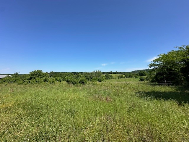 Exceptional opportunity to own 39.82 Acres +/- close to Prairie Grove and only 4 miles to the I-49 corridor. This beautiful gently rolling, partially wooded land is completely fenced with 2 ponds and a 24 X 36 pole barn. The abundant water well and electricity on site, makes it convenient for building your dream home with views, on one of the several available sites. This land is also versatile and can be used for cattle farming (property is currently leased for cattle), recreational use or escaping the city life. Schedule your showing to see this exceptional property today! Also, see MLS# 1308982
