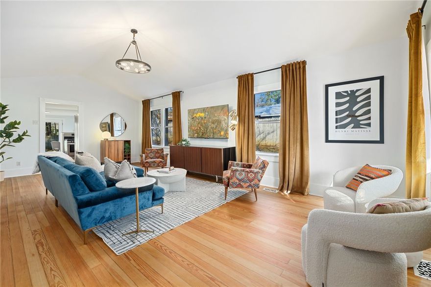 Double Lot! This updated home is nestled on .27 acres in the heart of Fayetteville! Just blocks away from the vibrant Fayetteville Square and minutes from the Razorback Greenway trails. Right around the corner are Dickson Street's shops and eateries, and the University of Arkansas campus. This meticulously updated home blends timeless character with modern upgrades for effortless downtown living.
Step inside to vaulted ceilings and beautifully refinished heart of pine wood floors that flow throughout the open layout. The fully remodeled bathroom features high-end finishes, while the kitchen shines with stainless steel appliances, custom cabinets, and luxurious quartz countertops. Stay comfortable year-round with new central heat and air, enhanced by energy-efficient new windows, siding, and gutters.
Outside, unwind on the spacious new front and back porches, perfect for enjoying your large, private yard –a rare find for downtown. Book a tour to view this property in one of Fayetteville's most desirable locations!