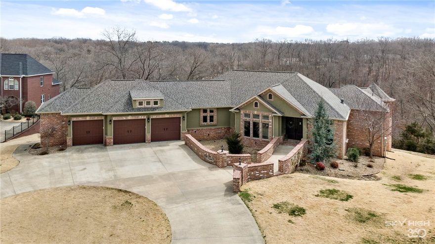 Enjoy comfortable opulence in custom-built stunner! Luxurious amenities adorn the home, nestled in a conveniently located, established neighborhood. Jump on the N Walton trail that abuts property for a short, picturesque bike ride to the Bentonville square. There's also an option to have a mountain biking trail built in back yard. Inside the home, all bedrooms are en suite, two up & two down. Gourmet kitchen has voluminous barreled ceilings and hidden pantry. Library paneling hides entry to "secret" 2nd bedroom. Flex space in basement is plumbed & ready for kitchen build-out. Custom shower downstairs has pet bath. Area off lower deck with half bath could be workshop or future cabana. Too many goodies to list...it's a must see! Bring your vision and create the back yard of your dreams!