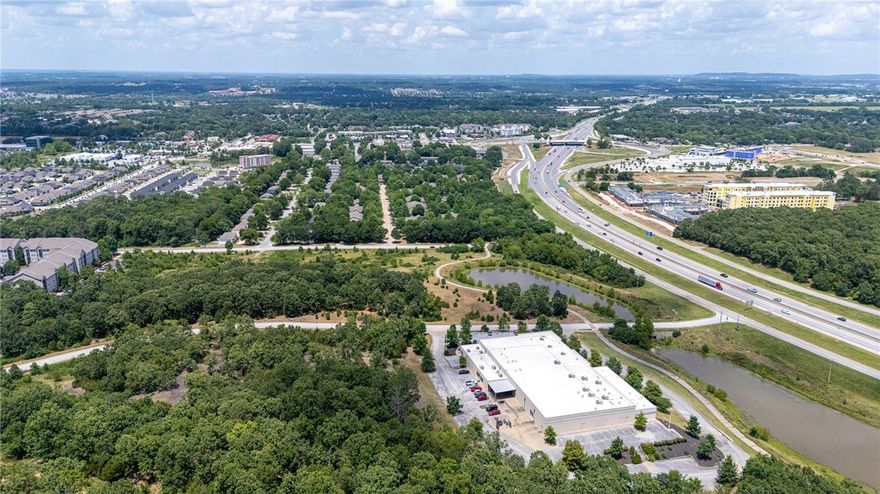 This rare four-parcel offering delivers nearly 30 acres of high-exposure, high-opportunity land in the heart of one of the fastest-growing regions in the country. Zoned C-2 and CS with City-approved High-Density City Neighborhood use, the site is ideal for multi-family, mixed-use, hospitality, retail, or office projects. Minutes from the University of Arkansas, national retailers, grocery centers, and Centennial Park’s 13+ miles of premier biking trails, the location combines regional draw with everyday convenience. A retention pond and paved access roads are already in place, simplifying future development. Strategically positioned along the I-49 corridor, Tech Way is surrounded by momentum—ongoing growth, major investments, and increasing demand. With scale, zoning, and infrastructure aligned, this is a standout opportunity for forward-looking developers ready to build big.
Parcels also available individually: MLS #1316207 (15.29 AC) and MLS #1316293 (14.28 AC).