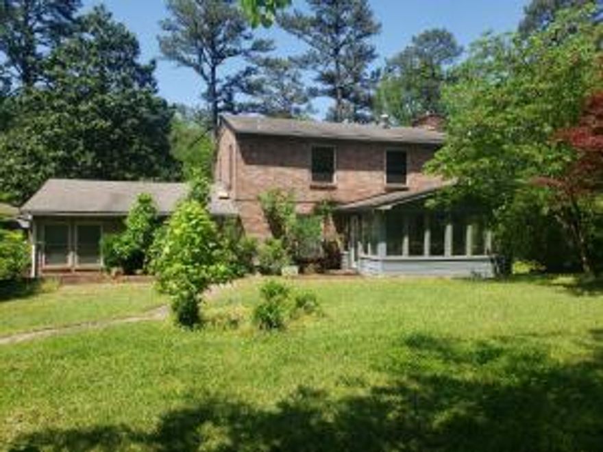 Country setting but still in town. 3 Bedrooms 2.5 Bath home on 1.7 acres. This home offers lots of space inside and out. With some updates this could be quite the home. The large open kitchen offers lots of cabinets and kitchen island. Lots of living space and even a sunroom. 2 car carport and workshop all on a dead end street.