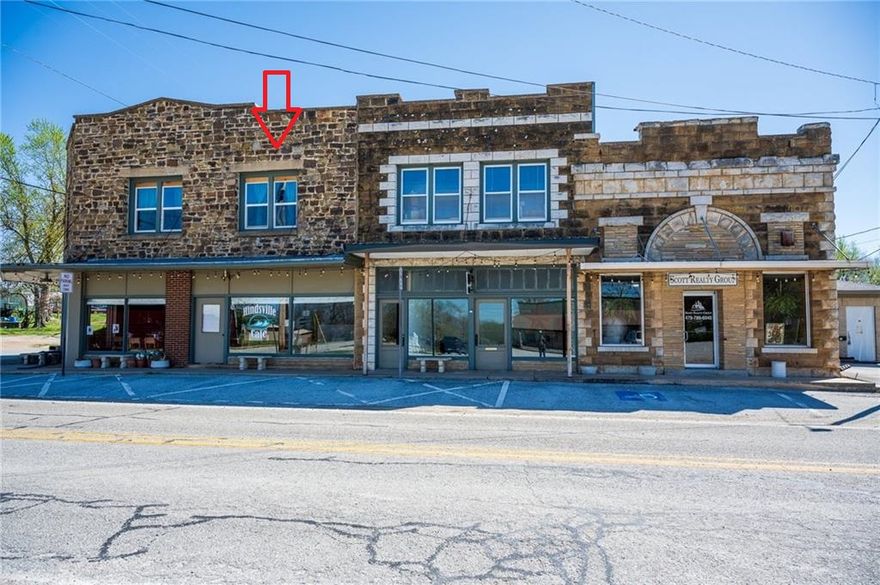 Charming Studio Loft above the Historical Cafe- Fully furnished and utilities included! Discover your ideal urban retreat with this beautifully remodeled studio loft apartment, perfectly situated above a trendy cafe in a historical building. Spanning 774 sq ft, this space is fully furnished with a king-size bed, a cozy pull-out couch, and stylish furnishings throughout. The apartment's prime location ensures an easy commute to Springdale, Fayetteville, and Huntsville, making it an excellent choice for professionals and commuters alike. Enjoy the convenience of all utilities being included in your monthly rent, and revel in the blend of modern comfort and historical charm. With a newly remodeled interior that retains the building's classic character, this studio offers both style and substance. At $1,200 per month with a $1,000 security deposit make this charming loft your new home! Agent Owned