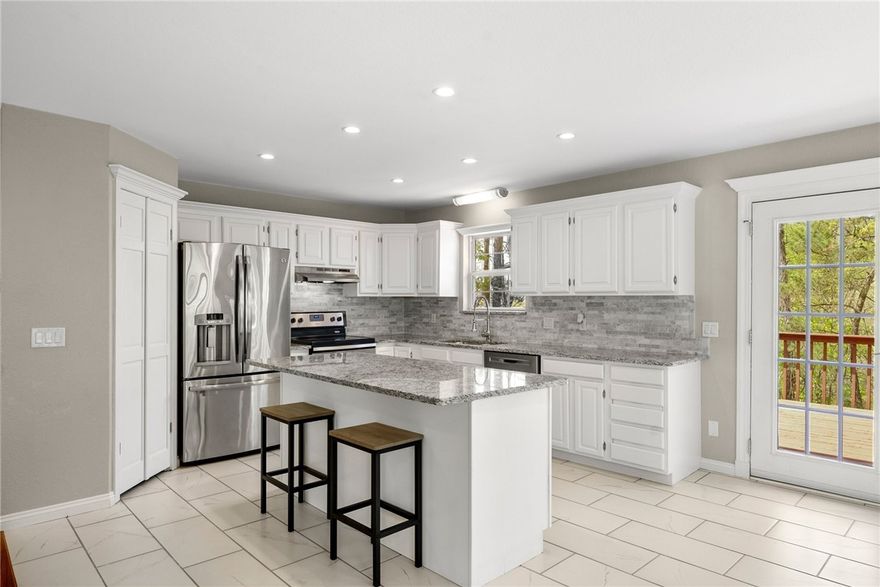 This beautifully remodeled 4-bedroom, 3-bath home is a dream-come-true of a lake retreat where 
anyone could live comfortably year-round. Combining modern elegance with cozy charm, its prime location is just minutes from the shores of NWA's favorite summer destination, Beaver Lake. The main level offers a bright and airy living space, perfect for entertaining, plus a luxurious primary suite with a walk-in closet and spa-inspired ensuite bathroom. With three additional bedrooms and another two full baths, there’s plenty of room for family, guests, or a home office. Enjoy peaceful mornings on the deck or gather 'round the firepit in the private backyard after a day on the water. Whether a buyer is looking for a full-time residence, weekend getaway, or vacation rental, this home checks all the boxes.