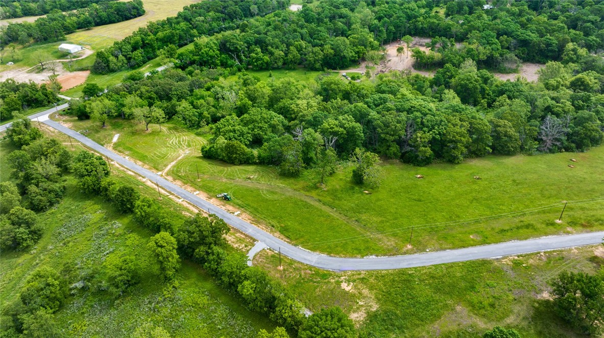 Welcome to Hill Country Estates ā where luxury meets nature in an exclusive new subdivision of private 3+ acre estate lots. Tucked along a scenic, winding drive, youāll find a world of rolling hills, mature trees, and peaceful seclusionāall just minutes from town and less than 20 minutes to vibrant downtown Bentonville. Each lot is gently sloping and partially wooded, offering the perfect backdrop for your custom dream home. Thoughtful covenants requiring a minimum 3,000 sq. ft. residence and 3-car garage, this is more than just landāitās a lifestyle, offering the rare privilege of true country serenity paired with city convenience.