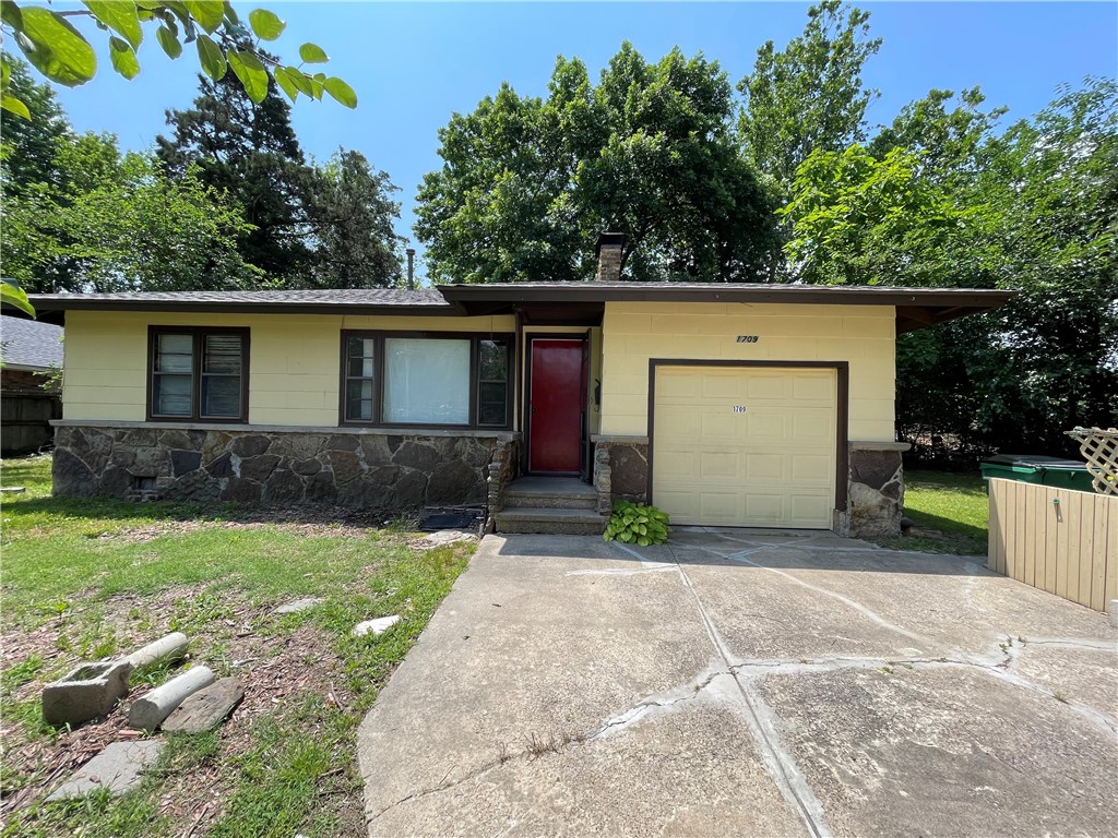 Lots of potential in this fixer upper investment property! Great location within walking distance to Westwood school, near hospital, near Murphy Park, Library & Hwy 412 shopping. Large 1 acre lot with storage building in backyard. Fully fenced yard with lots of mature trees. House has all the duct work for central H&A but is not currently working. Working window unit in kitchen. There is no heat at the property so this one will not work for FHA or VA financing - check with your lender if you plan to use financing to see if this property meets their lending requirements. This property is being sold "AS IS" with no sellers property disclosure due to the fact that the seller has never occupied the property