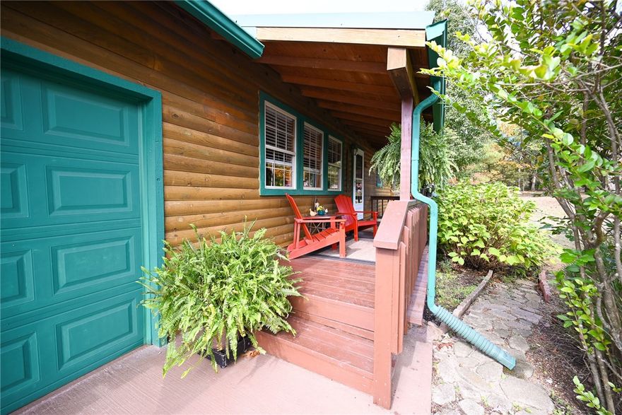 This well-kept, three-bedroom, two-bath log home sits on 1.09 acres (m/l) in the desirable Bergman School District. Tall ceilings and an open concept immediately welcome you, creating that warm, homey feeling. Premium features abound, including Corian countertops in the kitchen and bathrooms, custom cabinets, a three-car garage, and a privacy-fenced backyard that checks off a long list of wants.