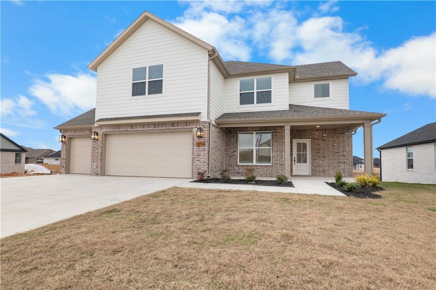 Experience the Bellingham plan at Spring Creek Farms. This modern community will feature a community pool, playground and walking trails.
The Bellingham Plan showcases elevated two-level living with five bedrooms (or four plus a bonus/office space), and 2.5 baths. Its open layout highlights vaulted beam ceilings, a gas log fireplace, and a seamless indoor–outdoor feel. The chef’s kitchen features soft-close custom cabinetry to the ceiling, a gas range with fully vented hood, built-in microwave, and both a butler’s pantry and walk-in pantry. The main-level primary suite offers a spa-inspired retreat with a walk-in shower and free-standing soaking tub. A 3-car garage and thoughtful details throughout complete this luxury design