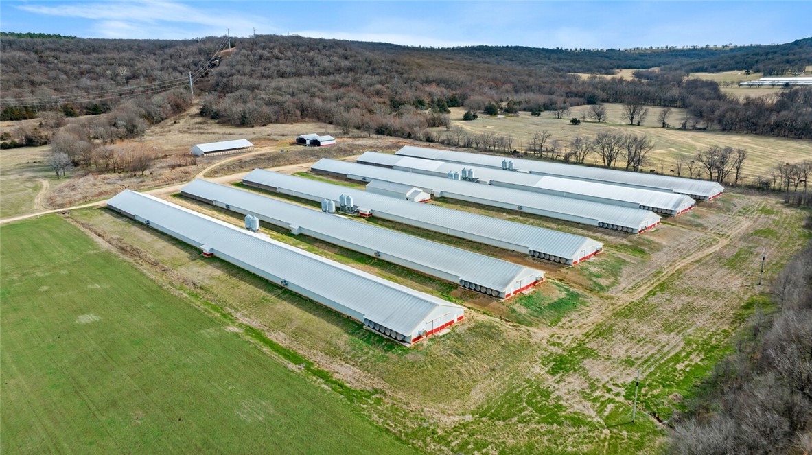 *****DO NOT ENTER WITHOUT AN APPOINTMENT - BIO-SECURITY IN PLACE **** DO NOT ENTER IF YOU HAVE BEEN AROUND A FARM OR FOWL OF ANY KIND **** LOOK LOOK LOOK This is a 6 house broiler operation with a current premium contract with George's in place, the property offers 80 acres mol and 4/2 brick home, Ozark Go/Electric, Black Hills Natural Gas, poultry houses were built in 2016 and are 55x600's, litter shed and compost shed(s), choretronics * A rare find! Welcome to Siloam Springs school district for your kiddos and a Fayetteville address - convenient to all NWA has to offer! WELCOME TO YOUR NEW HOME and income producing Broiler operation! *