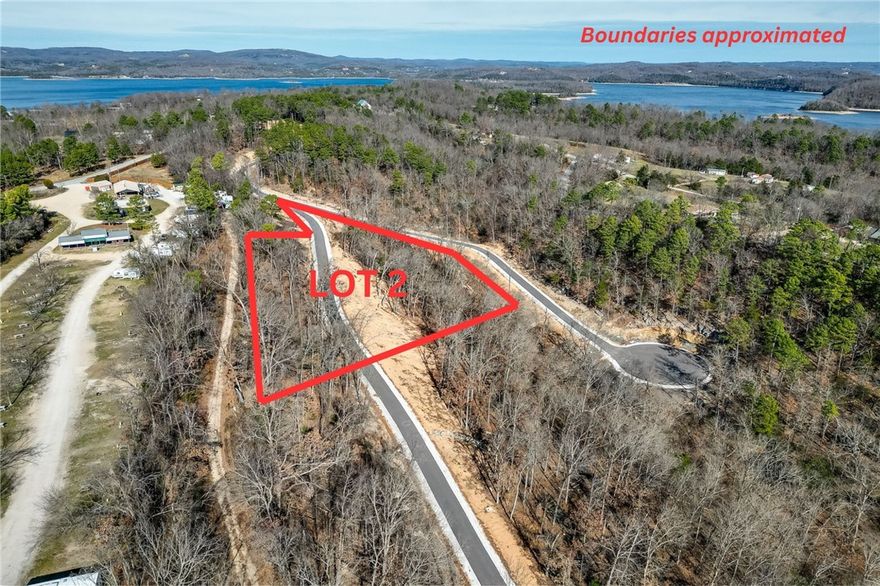 Discover the perfect canvas for your custom Beaver Lake area retreat at Blisslake, a new fully paved subdivision featuring 9 premier estate-sized lots with dedicated community recreation area and lakefront access for all lot owners. This 3.13-acre lot offers the ideal blend of privacy, natural beauty, & proximity to some of Northwest Arkansas' most sought-after amenities. Ideally located at the Northern end of Beaver Lake near Hobbs State Park & Rocky Branch Marina, the property is surrounded by endless opportunities for hiking, biking, boating, & outdoor recreation as well as just 20 minutes from downtown Rogers! The sloping terrain & serene wooded setting provide an exceptional backdrop for a luxury home designed to complement the Ozark landscape. Underground electric & water are available at the street, allowing for a visually clean, unobstructed setting while streamlining the building process. Build your dream home & experience the best of the Natural State!